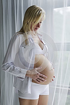 Young pregnant woman with her unborn child