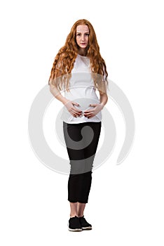 The young pregnant woman isolated on white