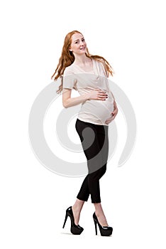 The young pregnant woman isolated on white