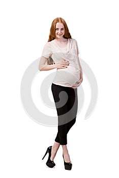 The young pregnant woman isolated on white