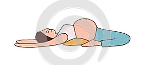 Young pregnant woman lying and stretching with loin on pillow. Pregnancy yoga pose for back pain. Mom with belly doing