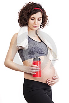 Young pregnant woman practicing fitness