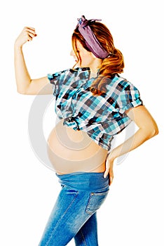 Young pregnant woman showing arm muscles