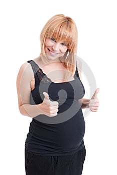 Young pregnant woman showing double like or thumbs-up gesture