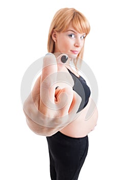 Young pregnant woman showing good luck sign