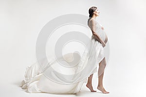Young pregnant woman in studio