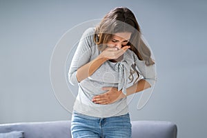 Young Pregnant Woman Suffering From Nausea