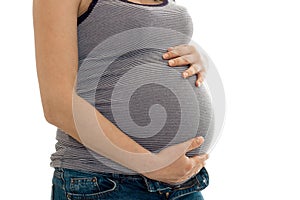 Young pregnant woman touching her belly isolated on white background