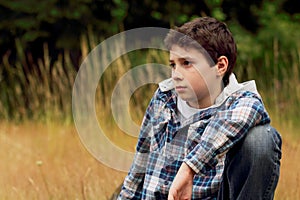 A Young Preteen Boy in Field photo