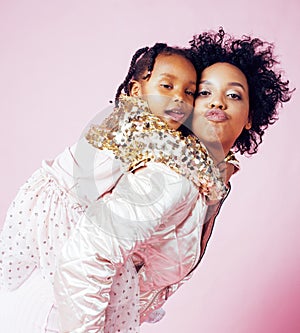 Young pretty african-american mother with little cute daughter h