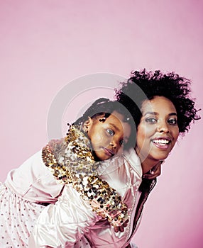 Young pretty african-american mother with little cute daughter h