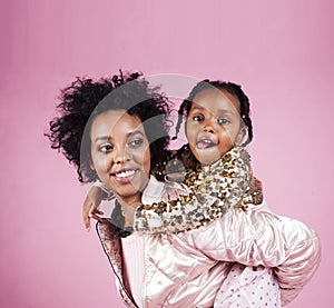 Young pretty african-american mother with little cute daughter h