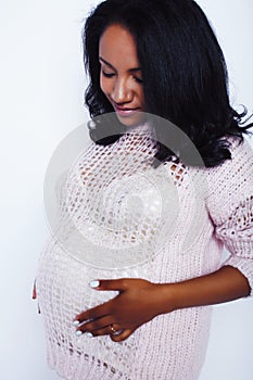 Young pretty african american woman pregnant happy smiling, posing on white background  , lifestyle people