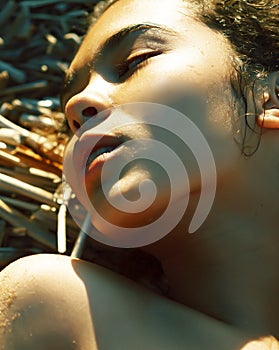 Young pretty african curly girl on sunset on beach looking, lifestyle people concept