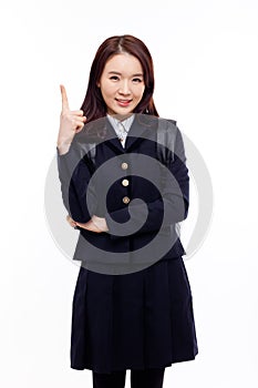 Young pretty Asian student indicate side space photo