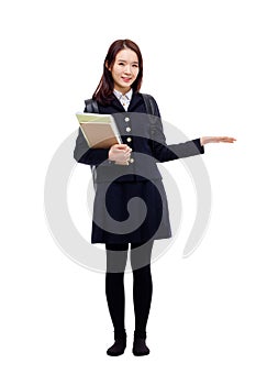 Young pretty Asian student indicate side space