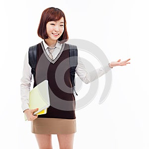 Young pretty Asian student indicate side space