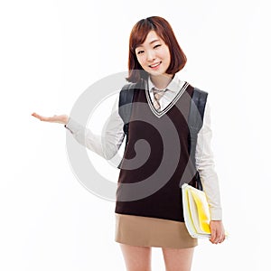 Young pretty Asian student indicate side space photo