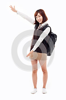 Young pretty Asian student indicate side space photo