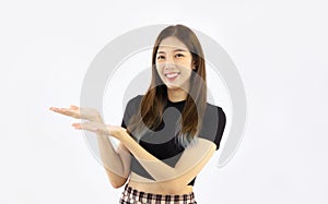 Young pretty asian woman in black t-shirt posing hand showing and presenting on your product white background