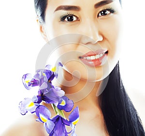 Young pretty asian woman with flower orchid close up isolated sp