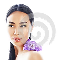 young pretty asian woman with flower purple orchid closeup isolated on white background spa smiling casual