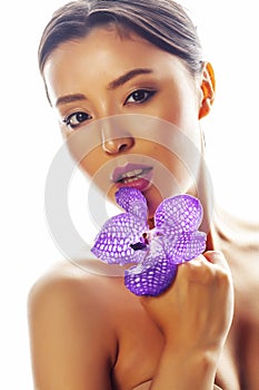 young pretty asian woman with flower purple orchid isolated on white background, spa people concept