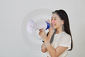 Young pretty Asian woman holding megaphone