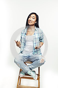 Young pretty asian woman posing cheerful emotional isolated on white background, lifestyle people concept