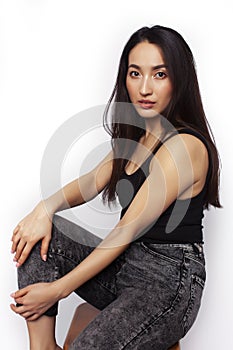 young pretty asian woman posing cheerful emotional isolated on white background, lifestyle people concept