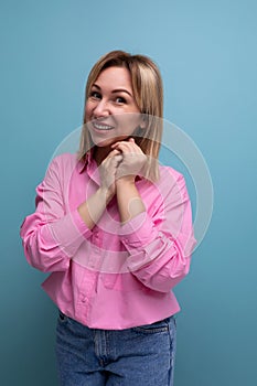 young pretty blond careerist leader woman with shoulder-length hair in a pink blouse