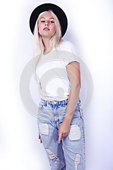 young pretty blond girl hipster in hat on white background casual close up dreaming smiling posing cheerful, lifestyle