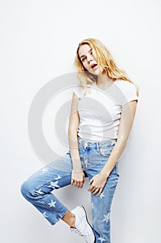Young pretty blond teenage girl emotional posing, happy smiling isolated on white background, lifestyle people concept