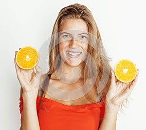 young pretty blond woman with half oranges close up  on white bright teenage smiling