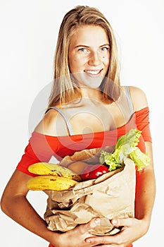 young pretty blond woman at shopping with food in paper bag isol