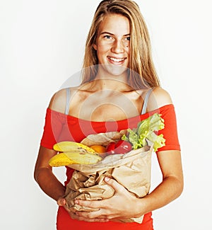 young pretty blond woman at shopping with food in paper bag isol