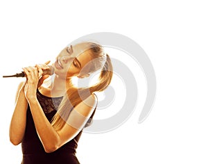 Young pretty blond woman singing in microphone isolated close up