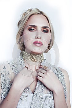 Young pretty blond woman wearing lot of luxury rich jewelry and fashion style makeup, lifestyle beauty people concept