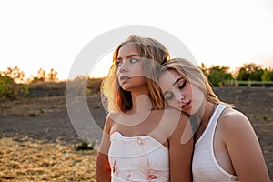 Young Pretty Blonde Women In Field Outdoor In Summer At Sunset