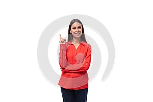 young pretty brunette caucasian model woman dressed in fashionable red shirt tells interesting news on white background