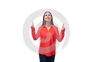 young pretty brunette caucasian model woman dressed in fashionable red shirt tells interesting news on white background