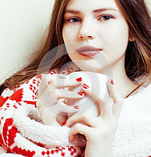 young pretty brunette girl in Christmas ornament blanket getting warm on cold winter, freshness beauty concept