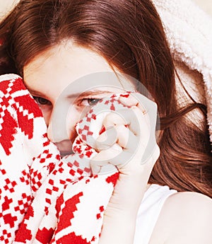 young pretty brunette girl in Christmas ornament blanket getting warm on cold winter, freshness beauty concept