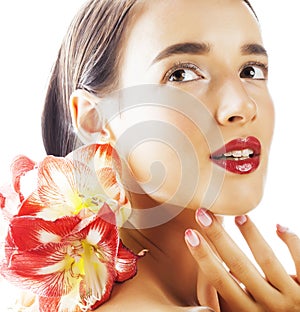 Young pretty brunette real woman with red flower amaryllis close