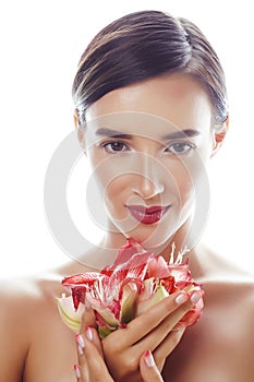 young pretty brunette real woman with red flower amaryllis close up isolated on white background. Fancy fashion makeup