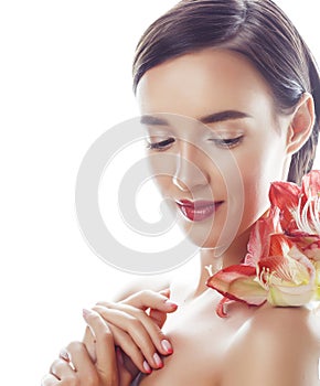 young pretty brunette real woman with red flower amaryllis close up isolated on white background. Fancy fashion makeup