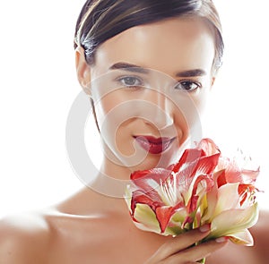 young pretty brunette real woman with red flower amaryllis close up  on white background. Fancy fashion makeup