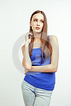 Young pretty brunette woman posing emotional isolated on white background thinking, lifestyle people concept