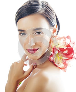 Young pretty brunette woman with red flower amaryllis close up isolated on white background. Fancy fashion makeup