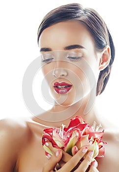 Young pretty brunette woman with red flower amaryllis close up isolated on white background. Fancy fashion makeup